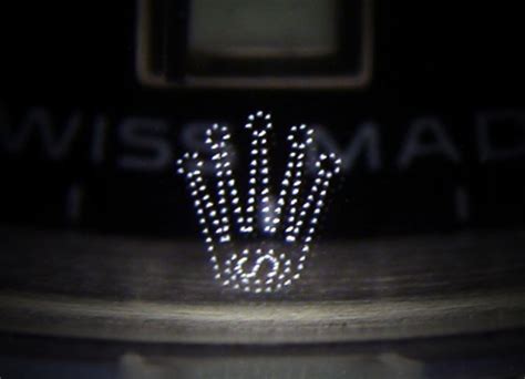 fake rolex crown logo on glass
